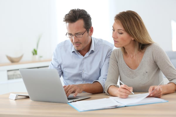 Couple at home working on laptop computer-2 Couple at home working on laptop computer-2
